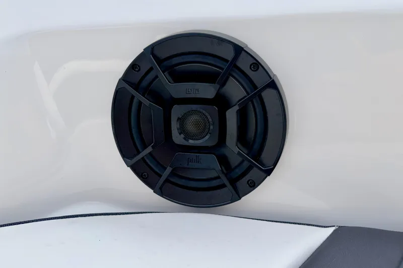 Slide: The Image of 2024 Yamaha AR195 boat speaker, black Polk audio system on white surface. - 57