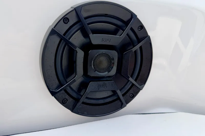 Slide: The Image of Close-up of a speaker on a 2024 Yamaha AR195 boat. - 58
