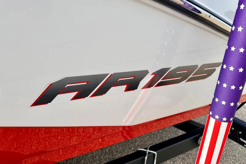 Slide: The Image of 2024 Yamaha AR195 boat logo with American flag-themed pole. - 6