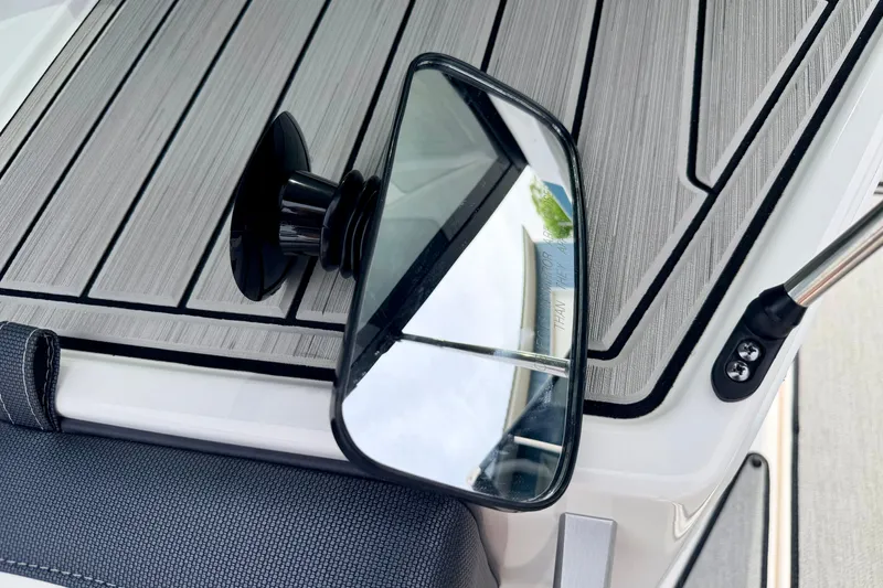 Slide: The Image of 2024 Yamaha AR195 boat mirror on sleek, modern deck surface. - 65