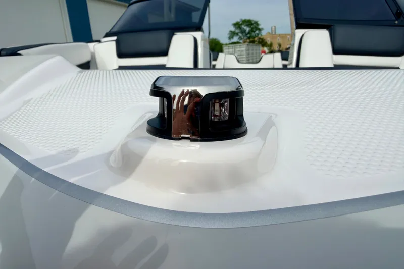 Slide: The Image of 2024 Yamaha AR195 boat deck with navigation light and seating in background. - 69