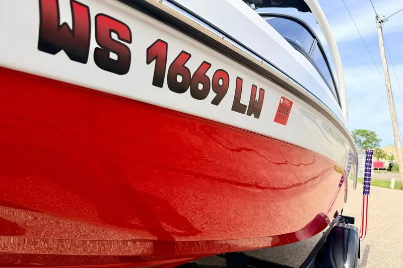 Slide: The Image of 2024 Yamaha AR195 boat with red hull and registration number WS 1669 LW. - 8