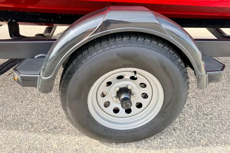 Slide: The Image of 2024 Yamaha AR195 trailer wheel with black fender on asphalt surface. - 9