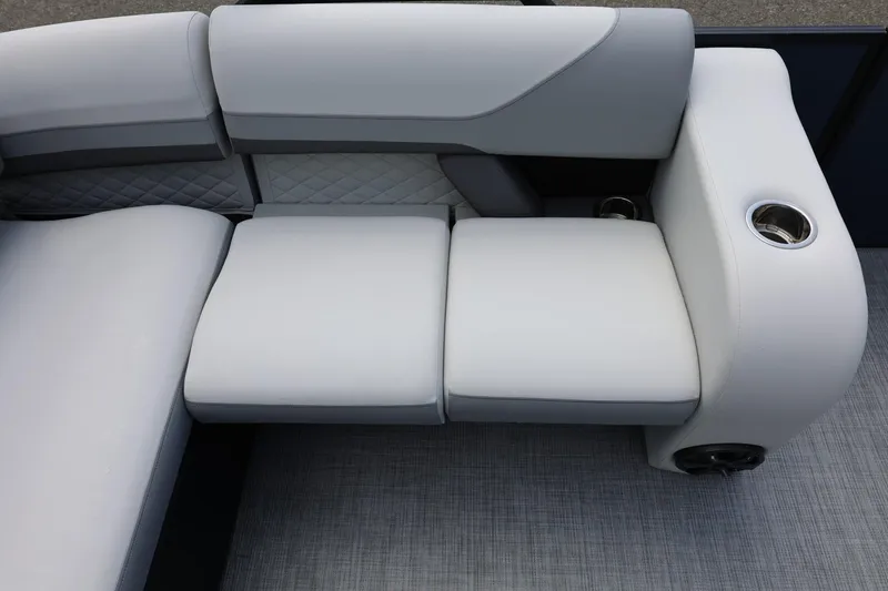 Slide: The Image of 2026 Lowe SS 210 CL boat interior with plush seating and cup holders. - 21