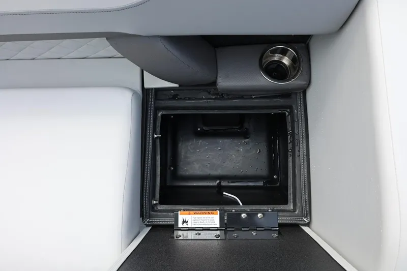 Slide: The Image of Open storage compartment in 2026 Lowe SS 210 CL boat with cup holder. - 23