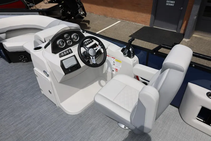 Slide: The Image of 2026 Lowe SS 210 CL boat interior with modern helm and comfortable seating. - 24