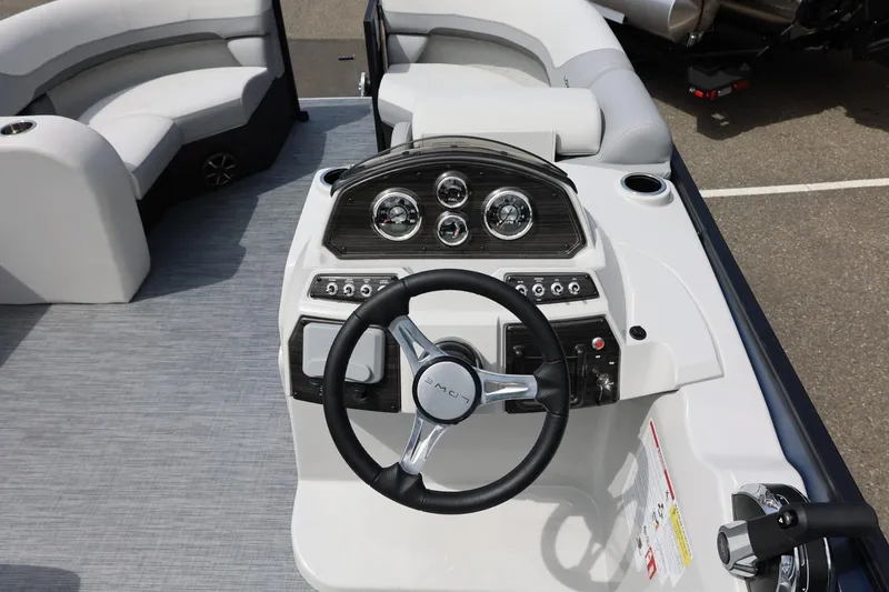 Slide: The Image of 2026 Lowe SS 210 CL boat dashboard with steering wheel and gauges. - 25