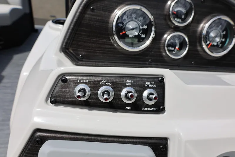 Slide: The Image of Dashboard controls of 2026 Lowe SS 210 CL boat with gauges and switches. - 26