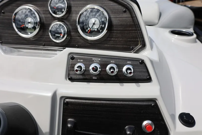 Slide: The Image of Dashboard of 2026 Lowe SS 210 CL boat with gauges and switches. - 27