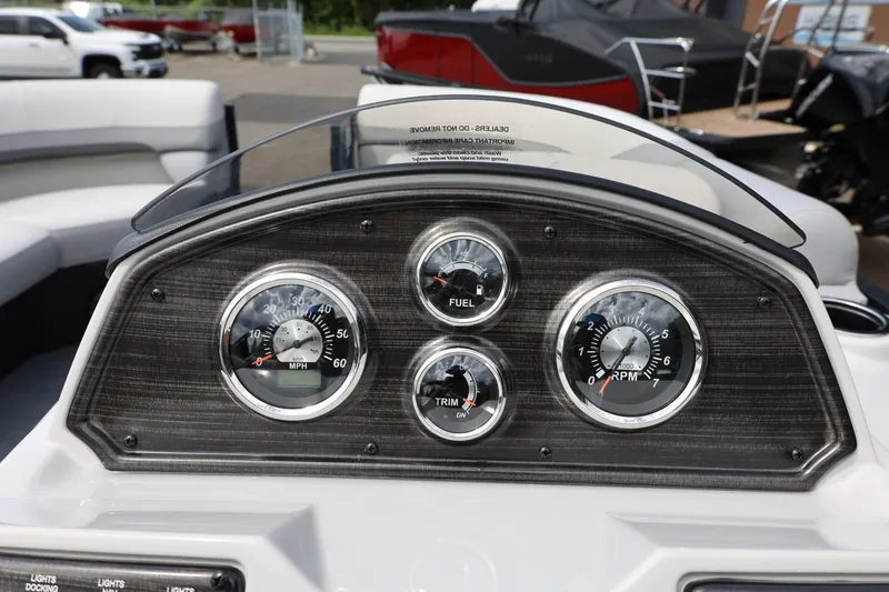 Slide: The Image of Dashboard of 2026 Lowe SS 210 CL boat with speedometer, fuel, trim, and RPM gauges. - 28