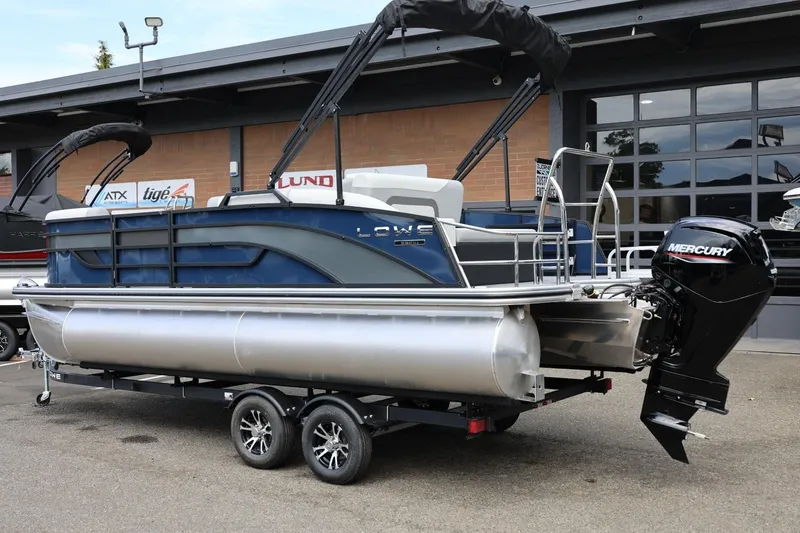 Slide: The Image of 2026 Lowe SS 210 CL pontoon boat with Mercury outboard motor on trailer. - 3