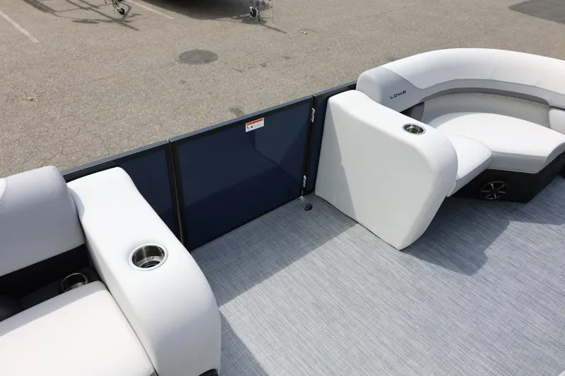 Slide: The Image of 2026 Lowe SS 210 CL pontoon boat interior with white seating and cup holders. - 33