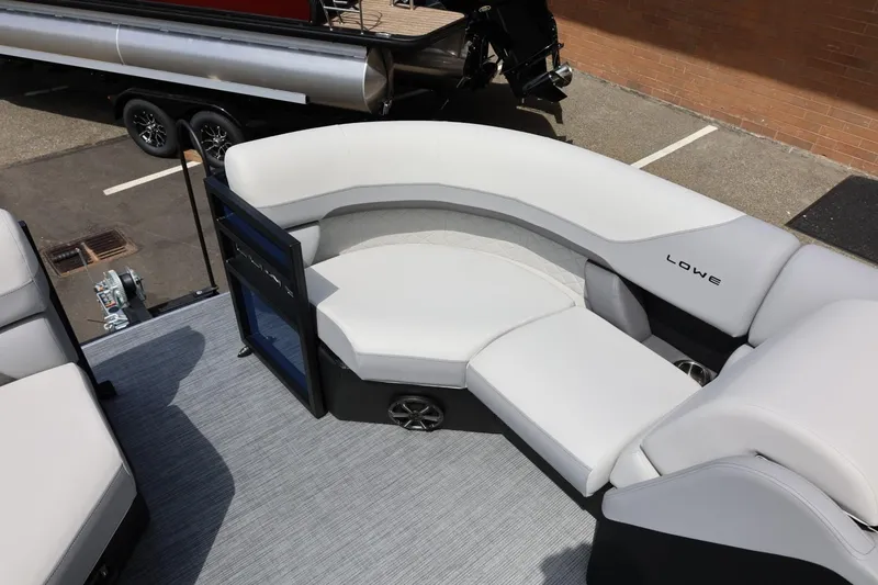 Slide: The Image of 2026 Lowe SS 210 CL pontoon boat with sleek seating and modern design. - 35