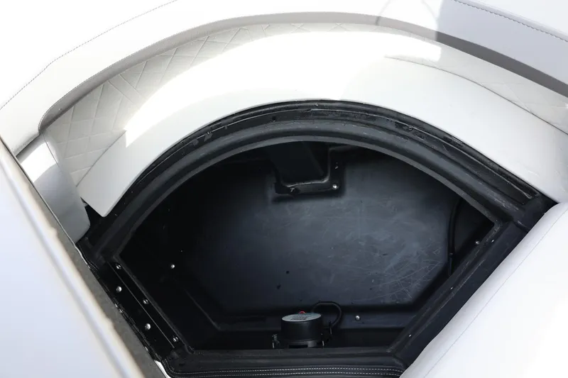 Slide: The Image of Storage compartment of 2026 Lowe SS 210 CL boat, featuring white cushioned seating. - 38