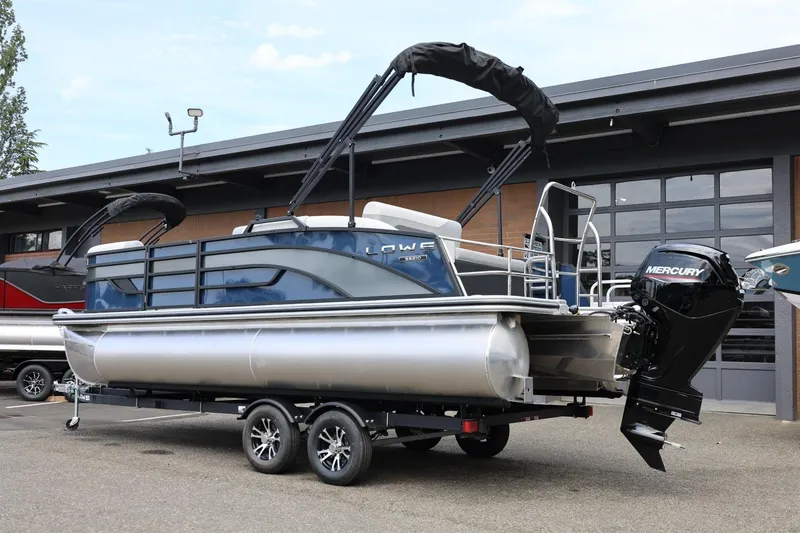 Slide: The Image of 2026 Lowe SS 210 CL pontoon boat with Mercury outboard motor on trailer. - 4