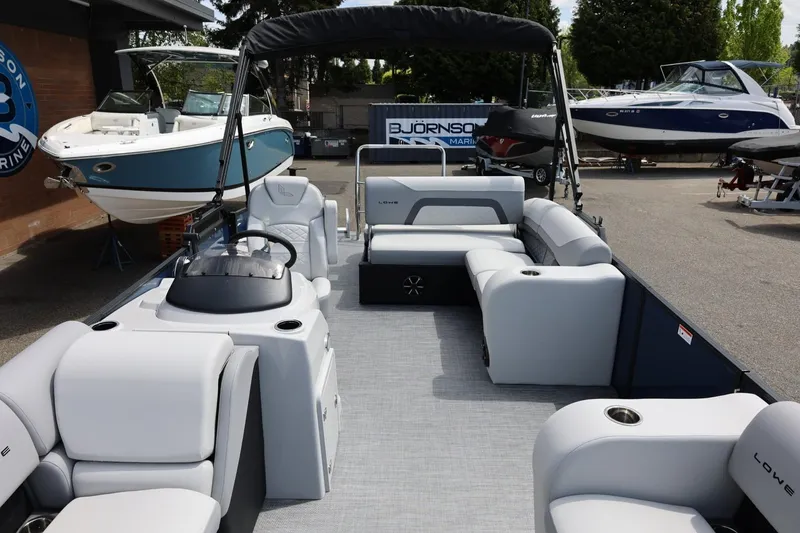 Slide: The Image of 2026 Lowe SS 210 CL pontoon boat with spacious seating and modern design. - 41