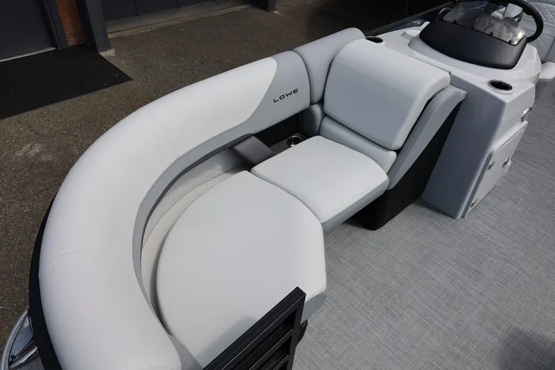 Slide: The Image of 2026 Lowe SS 210 CL boat interior with sleek, modern seating and console design. - 43