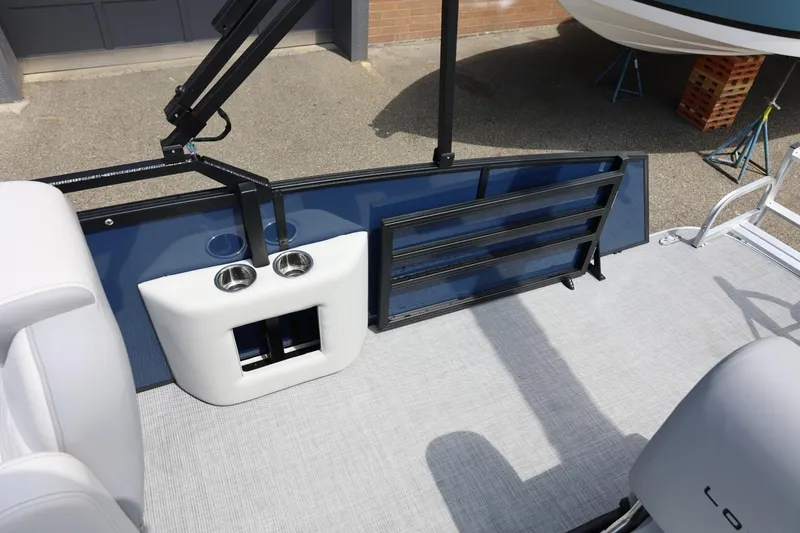 Slide: The Image of 2026 Lowe SS 210 CL boat interior with cup holders and seating area. - 45
