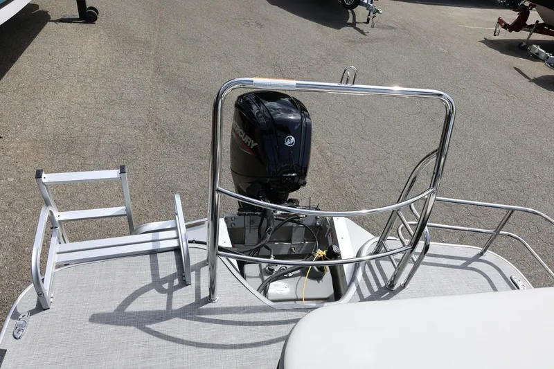Slide: The Image of 2026 Lowe SS 210 CL pontoon boat with Mercury outboard motor and swim ladder. - 46