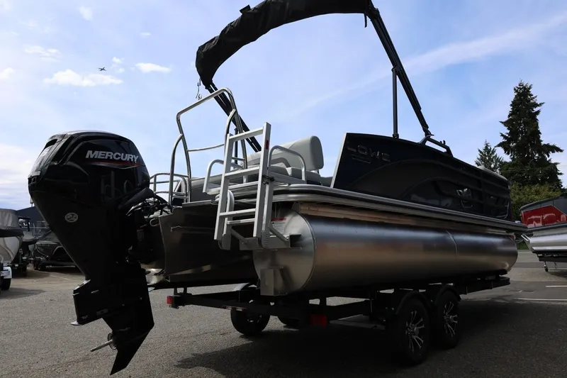 Slide: The Image of 2026 Lowe SS 210 CL pontoon boat with Mercury engine on trailer. - 8