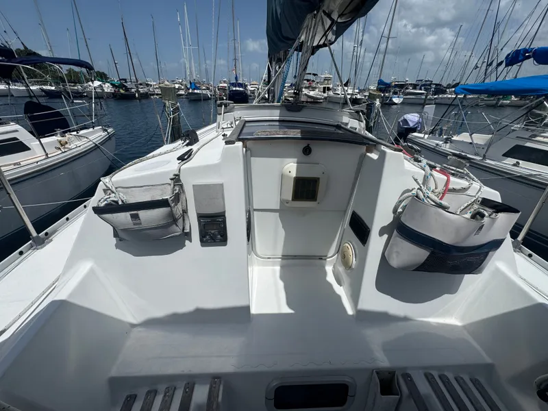 Slide: The Image of 1988 Beneteau First 285 sailboat in marina, sunny day. - 12