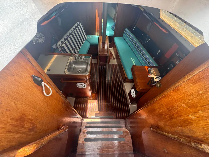 Slide: The Image of Interior of a 1988 Beneteau First 285 yacht with wooden finish. - 14