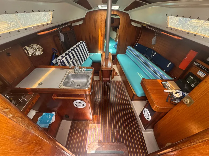 Slide: The Image of Interior of a 1988 Beneteau First 285 yacht with wooden finish. - 15