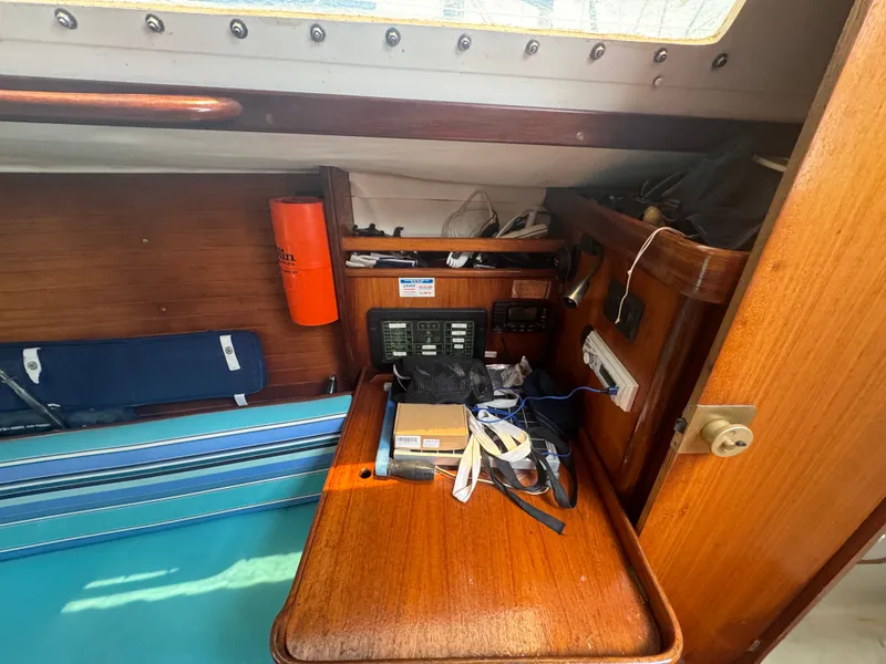 Slide: The Image of Interior of a 1988 Beneteau First 285 yacht with wooden furnishings. - 17