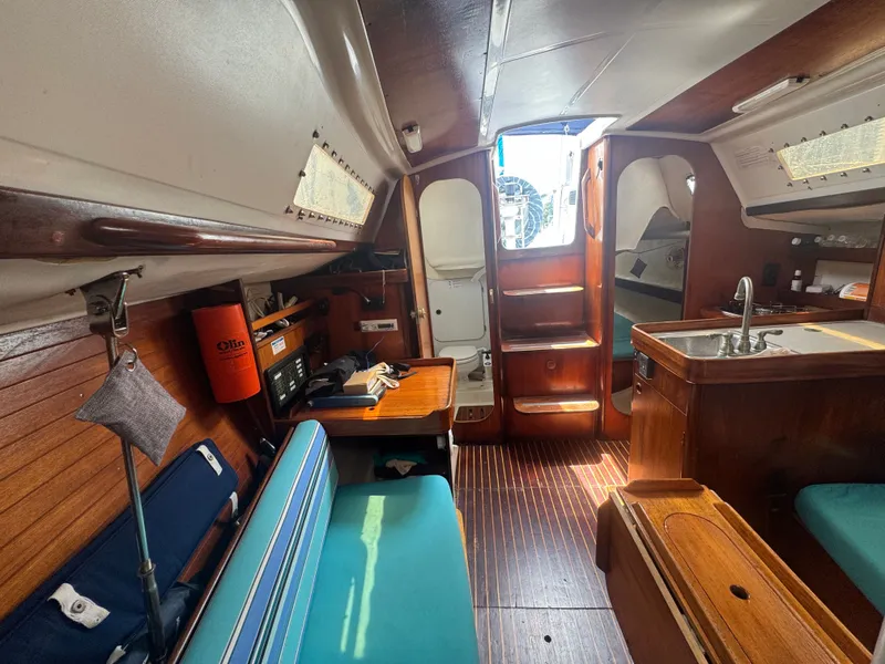 Slide: The Image of Interior of a 1988 Beneteau First 285 yacht with wooden finish. - 21