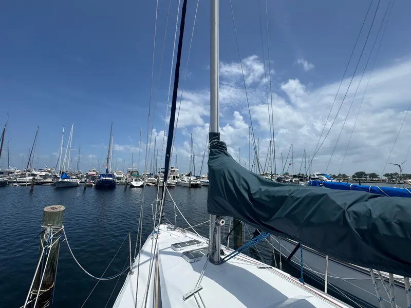 Slide: The Image of Beneteau First 285 sailboat in harbor, 1988 model, under sunny skies. - 29