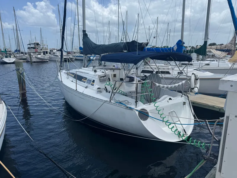 Slide: The Image of 1988 Beneteau First 285 sailboat docked in marina. - 3