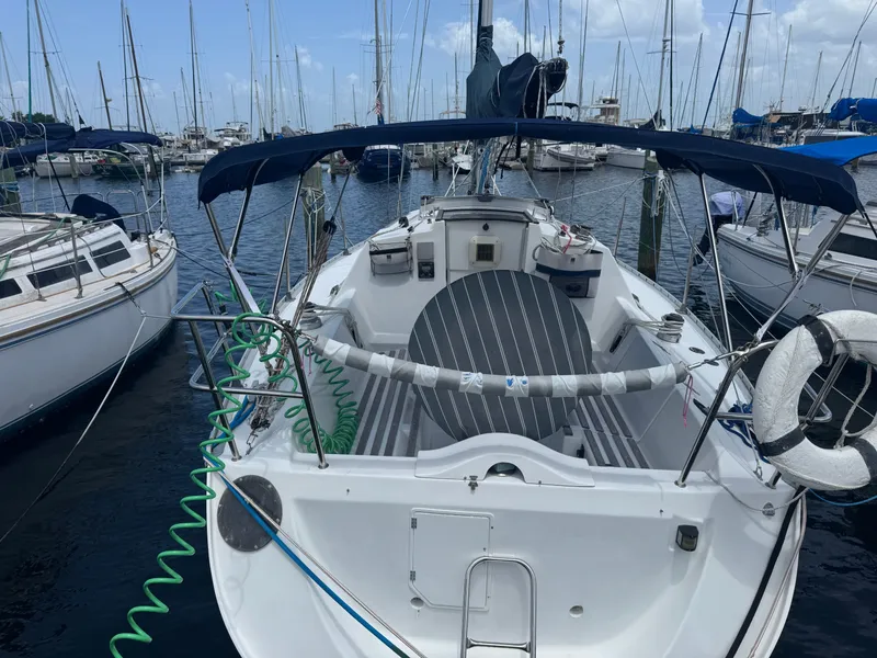 Slide: The Image of 1988 Beneteau First 285 sailboat docked in marina. - 5