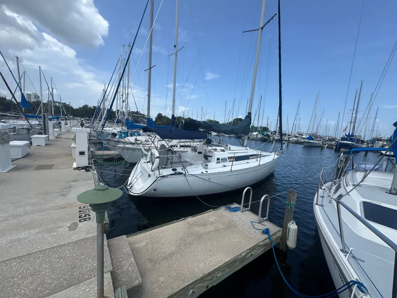 Slide: The Image of 1988 Beneteau First 285 sailboat docked at marina. - 6