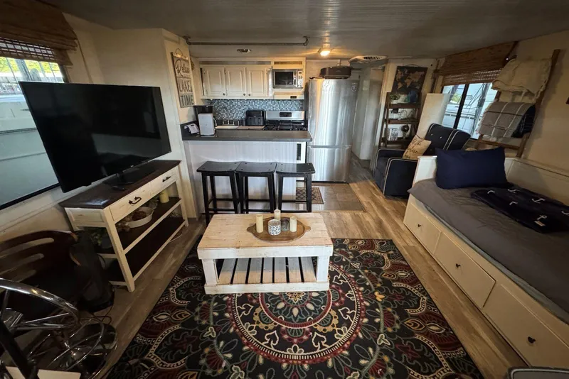 Slide: The Image of Interior of a 2006 Catamaran Cruisers Aqua Cruiser Executive, featuring cozy living space and modern kitchen. - 10