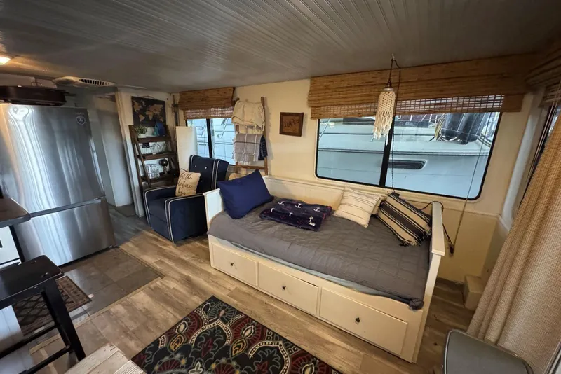 Slide: The Image of Interior of 2006 Catamaran Cruisers Aqua Cruiser Executive, featuring cozy seating and modern decor. - 11