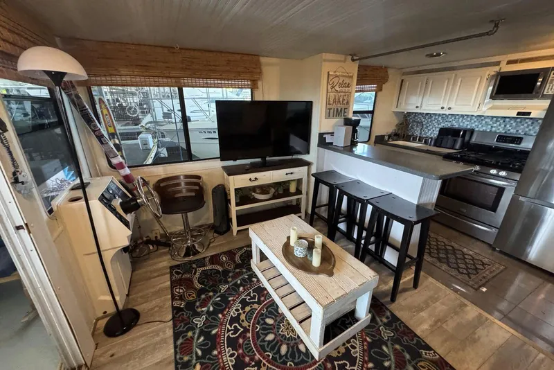 Slide: The Image of Interior of 2006 Catamaran Cruisers Aqua Cruiser Executive with modern kitchen and cozy living area. - 12