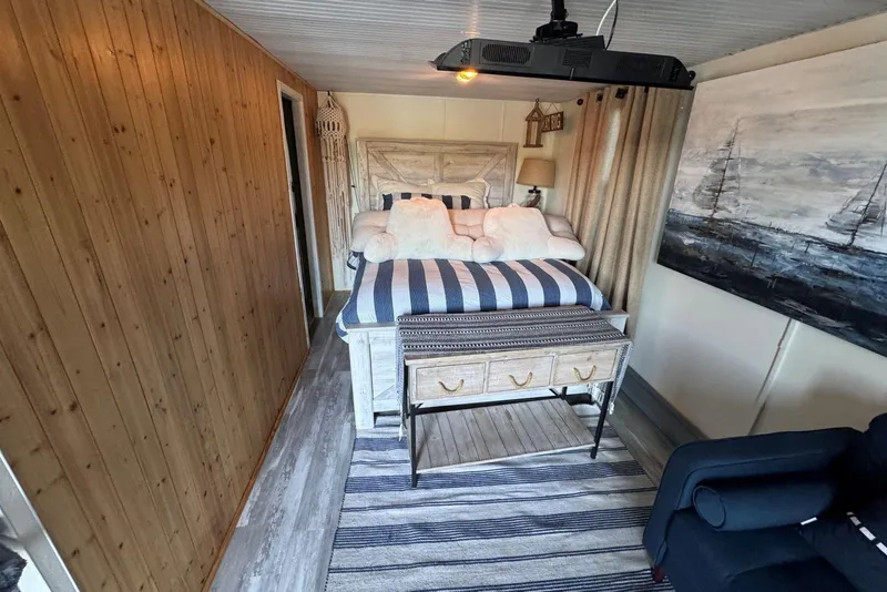 Slide: The Image of Cozy bedroom in 2006 Catamaran Cruisers Aqua Cruiser Executive, featuring nautical decor and wood paneling. - 20