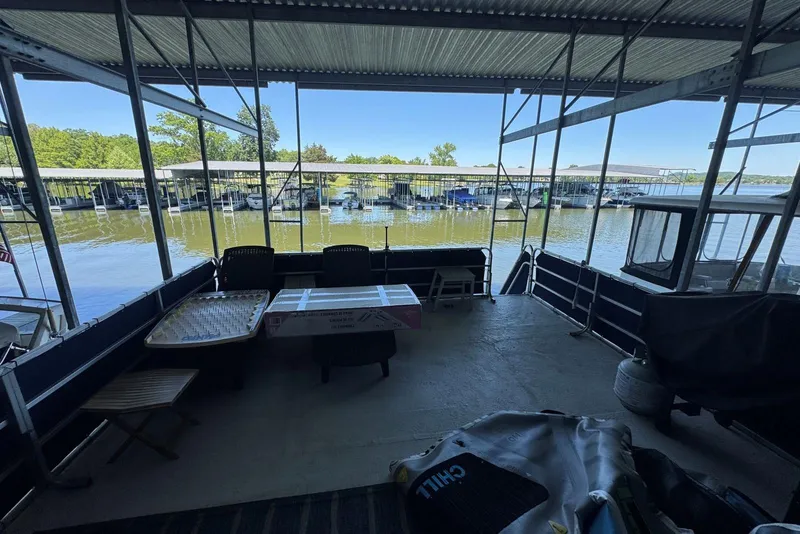 Slide: The Image of 2006 Catamaran Cruisers Aqua Cruiser Executive 51' docked, featuring spacious deck and marina view. - 26