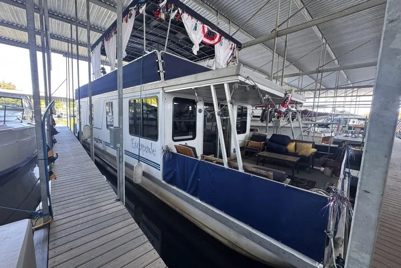 Slide: The Image of 2006 Catamaran Cruisers Aqua Cruiser Executive 51' docked in a covered marina. - 4