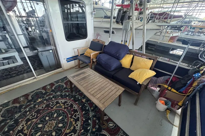 Slide: The Image of Cozy seating area on 2006 Catamaran Cruisers Aqua Cruiser Executive 51' houseboat. - 8