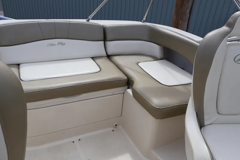 Slide: The Image of 2007 Sea Ray 220 Sundeck interior seating with beige and white upholstery. - 14
