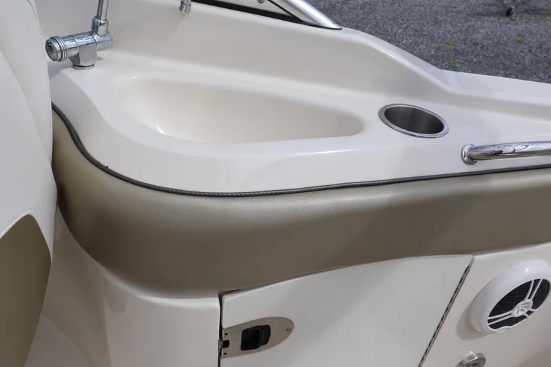 Slide: The Image of 2007 Sea Ray 220 Sundeck boat interior with sink and cup holder. - 17
