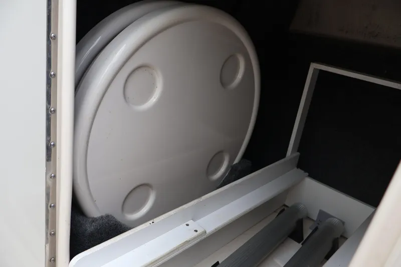 Slide: The Image of Storage compartment in a 2007 Sea Ray 220 Sundeck boat. - 31