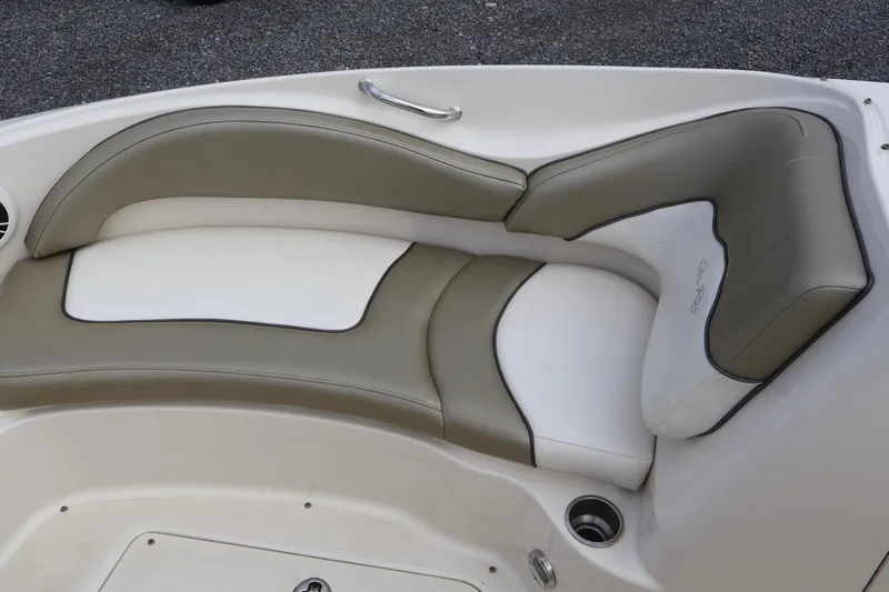 Slide: The Image of 2007 Sea Ray 220 Sundeck boat seating with beige and white upholstery. - 35