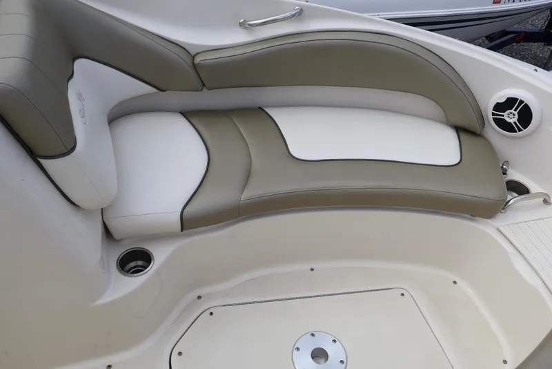 Slide: The Image of 2007 Sea Ray 220 Sundeck interior seating with beige and white upholstery. - 37
