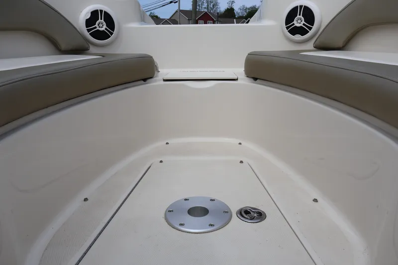 Slide: The Image of Interior view of 2007 Sea Ray 220 Sundeck boat with cushioned seating and speakers. - 38
