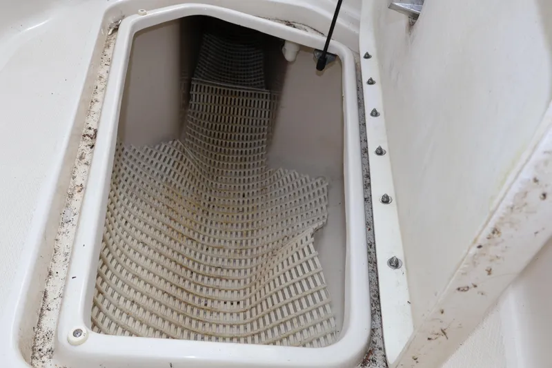 Slide: The Image of Storage compartment of a 2007 Sea Ray 220 Sundeck boat with open hatch. - 39