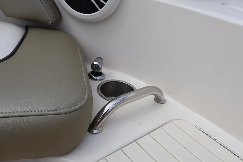 Slide: The Image of 2007 Sea Ray 220 Sundeck interior detail with seat, speaker, and stainless steel handle. - 41
