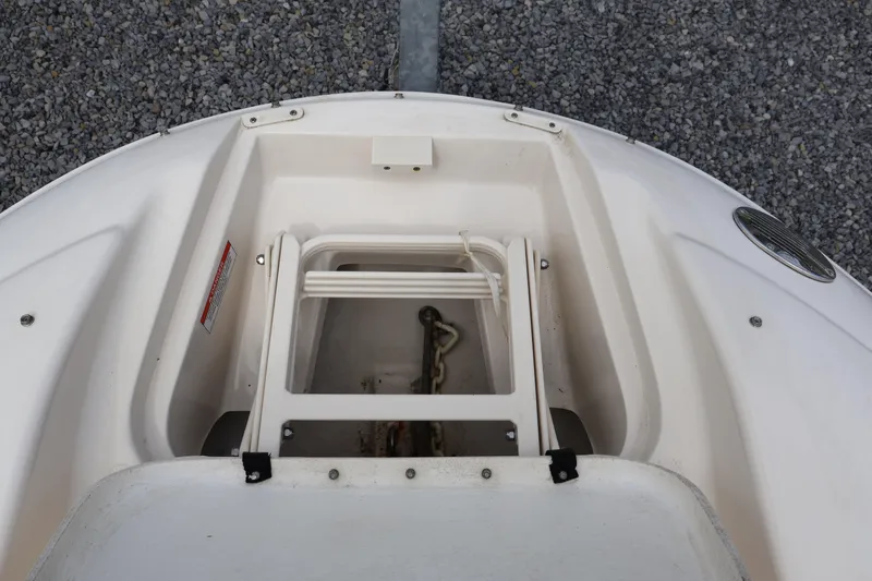 Slide: The Image of Bow storage compartment of a 2007 Sea Ray 220 Sundeck boat, featuring anchor and ladder. - 43