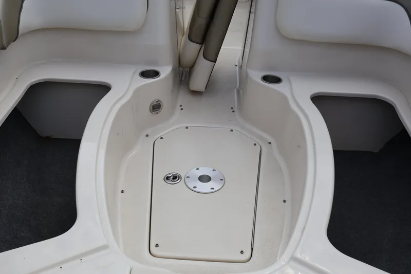 Slide: The Image of 2007 Sea Ray 220 Sundeck interior with seating and storage compartments. - 45